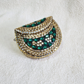 Kundan Brass Brass Clutch Green and Gold